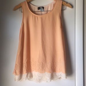 Peach sleeveless top with perforated waistline